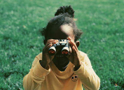 5-8 girl with binoculars.png