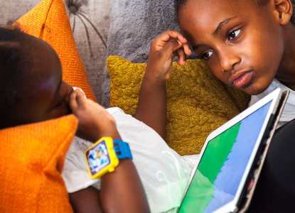 Two children with an ipad