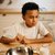 Child reading recipe