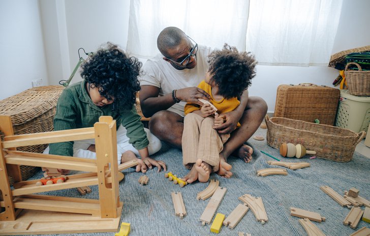 Parent playing with toys with children