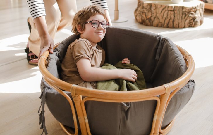 child playing in basket