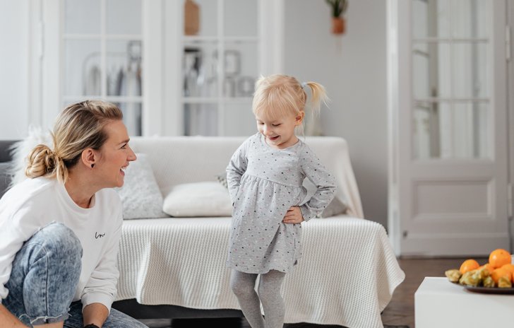 mother and daughter laughing
